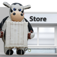 Structure gonflable en forme de vache avec panneau. Utilisée comme élément publicitaire pour événements ou points de vente
